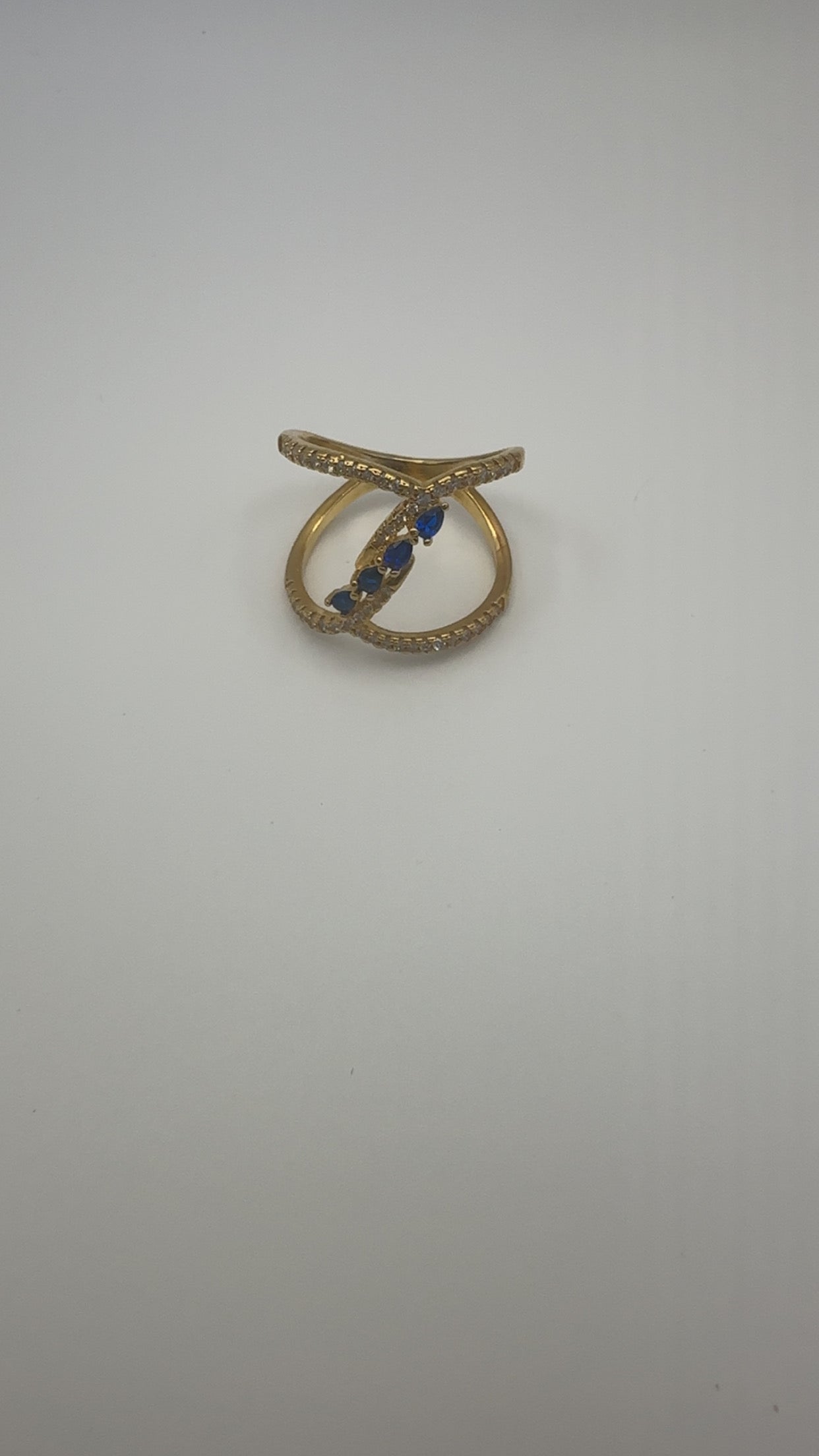 Double loop with blue stones ring