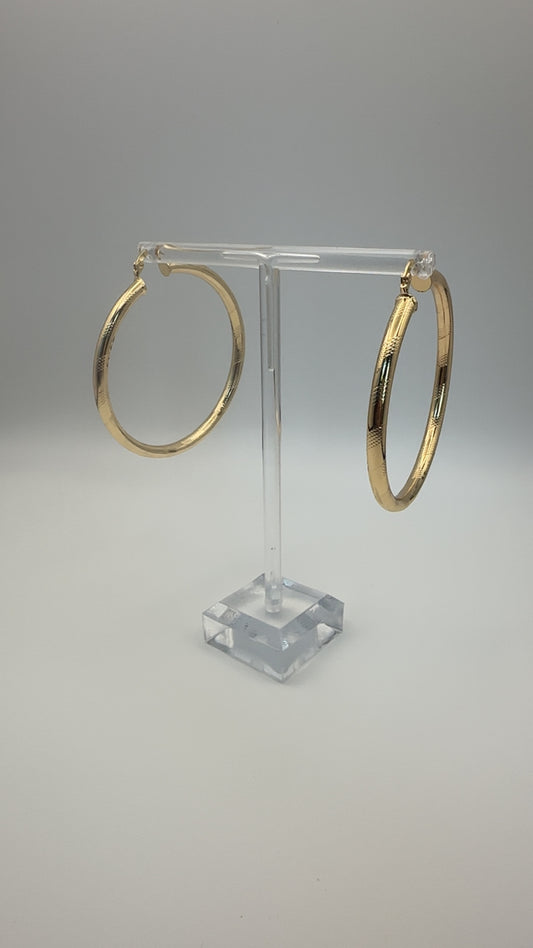 Big gold hoop earring
